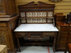 A vintage carved and tile back marble topped wash stand, 107cms wide
