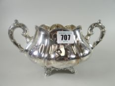 A heavy quality floral-engraved and fluted twin-handled silver sucrier, raised over four scroll