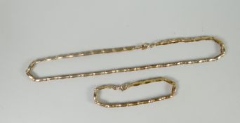 A modern 9ct yellow gold matching necklace and bracelet, 28gms Please note: weights and measurements