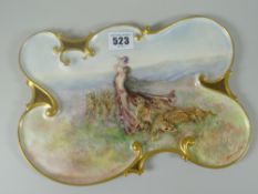 A Limoges porcelain tray or plaque of scrolling form with gilded rim and painted with a scene of