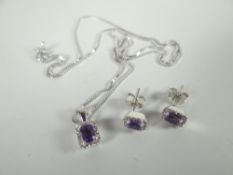 A modern 18ct white gold and amethyst earrings, pendant and necklace ensemble, 5gms Please note: not