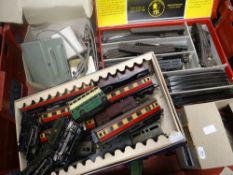 A collection of Trix Twin Railway tin-plate 00 gauge stock and two locos together with a large