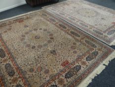 A PAIR OF KESHAN 100% pure wool carpets in cream ground 274 x 366cms