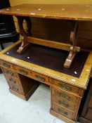 A NEAT OAK AND LEATHER TOOL TOPPED KNEEHOLE DESK, together with a similar wood coffee table