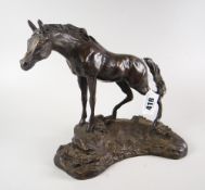 BRONZE study of a standing horse on naturalistic base, unsigned, 17.5cm high.