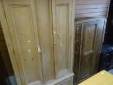 A STRIPPED PINE TWO DOOR WARDROBE with an internal storage cupboard base, together with a smaller