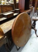 A VINTAGE OAK MIRRORED DRESSING TABLE with shelf and drawer back, together with a vintage circular