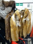 A CHRISTEN VINTAGE RED FOX FUR JACKET together with a similar dark brown fur jacket and vintage