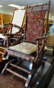 A VINTAGE AMERICAN ROCKING CHAIR with bobbin turned arms and back
