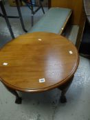A VINTAGE FOOTSTOOL together with a circular coffee table