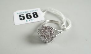 A GOOD MODERN WHITE METAL SET DIAMOND CLUSTER RING approximately 25 diamonds