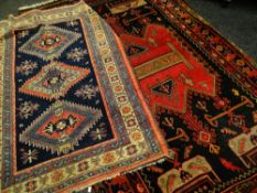 LARGE EASTERN DESIGN RUG decorated with ewers and other symbols within geometric borders