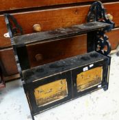 AN EBONISED AND GILT HANGING WALL SHELF AND CUPBOARD with Oriental decorated panels