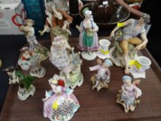 A GOOD GROUP OF TEN PORCELAIN FIGURINES (including a pair of candlestick holders) various marks,