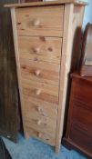 A NARROW PINE SEVEN-DRAWER CHEST