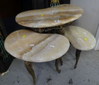 A NEST OF TABLES in gilt metal with marble tops