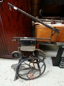 A VINTAGE TREADLE FRET-SAW together with a metal flywheel