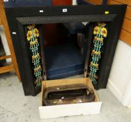 A CAST METAL FIRE GRATE with tiled insert and fittings