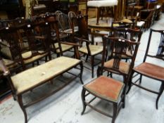 AN EDWARDIAN MAHOGANY BOUDOIR SUITE comprising small sofa, two armchairs and four other chairs