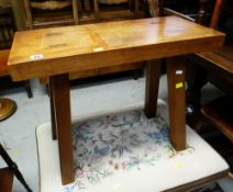 A GOOD RUSTIC OAK FOUR-LEGGED STOOL