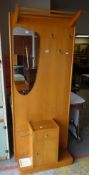 A VINTAGE LIGHT WOOD MIRRORED HALL STAND with drawer and cupboard base
