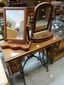 A VINTAGE METAL SEWING MACHINE BASE, together with two small toilet mirrors