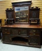AN IMPOSING MIRROR-BACKED SIDEBOARD with drawer and cupboard base and stepped shelved back, circa