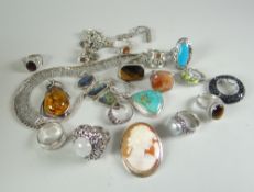AN ASSORTMENT OF SILVER JEWELLERY to include cameo brooch, rings etc.