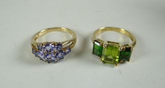 TWO NINE CARAT GOLD RINGS, one with peridot, the other with tanzanite