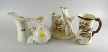 THREE VARIOUS ROYAL WORCESTER IVORY GROUND JUGS and a Worcester figural spillholder (damaged).