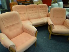 A GOOD ERCOL BLONDE THREE-PIECE SUITE with detachable buttoned orange upholstered cushions