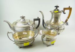 A FOUR-PIECE SILVER TEASET of oval form on bun feet and having feathered borders comprising