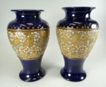 A PAIR OF DOULTON LAMBETH VASES of baluster form with lacework bodies, 26cms high