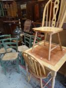 A MODERN LIGHT WOOD TILED TOP KITCHEN TABLE with two matching chairs, together with a set of four