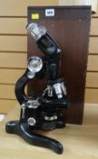 A MICROSCOPE being a good vintage black enamelled and chrome 'High Power Binocular' microscope