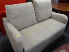 AN AS NEW FLECKED MATERIAL TWO-SEATER SOFA BED