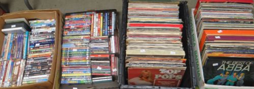 TWO CRATES OF DVDS, together with two crates of LP records mainly pop