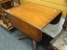 REPRODUCTION MAHOGANY DROP LEAF TABLE raised on four splay legs with brass paw cup and castors 76