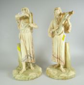 PAIR OF ROYAL WORCESTER BLUSHED IVORY EGYPTIAN REVIVAL FIGURES, modelled by JAMES HADLEY, each