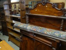 A VINTAGE OAK TALL PEG-ENDED BOOKCASE, together with a flame mahogany shelf-backed sideboard and