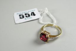 DIAMOND RING being an 18-carat yellow gold ruby and diamond chip ring in box, 3.7 grams