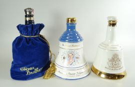 WHISKY DECANTERS being two Bells Old Scotch whisky decanters and a Chivas Regal bottle with cover