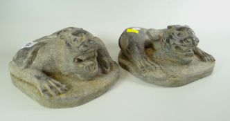 A PAIR OF ORIENTAL STONEWARE DRAGONS reclining on naturalistic bases, believed to be home entrance