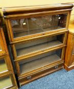 C20TH GLOBE WERNICKE-TYPE SECTIONAL BOOKCASE having three glazed compartments above drawer, 114