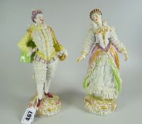 PAIR OF CONTINENTAL PORCELAIN LACEWORK FIGURES in the form of an elegantly dressed aristocrat male