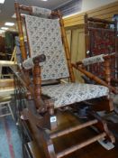 VINTAGE AMERICAN ROCKING CHAIR with bobbin turned back and arm supports