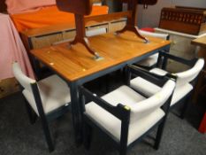 A MATCHING PINE EXTENDING DINING TABLE AND SIDEBOARD on painted supports and with 4+2 upholstered