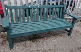 A WOODEN PAINTED GREEN GARDEN BENCH