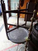 A LARGE CIRCULAR WHITE METAL ISLAMIC DECORATED TRAY, together with a table base and metal table,