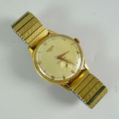 A GENTS LONGINES 'FLAGSHIP' WRISTWATCH circa 1950s with expanding yellow metal bracelet, the dial
